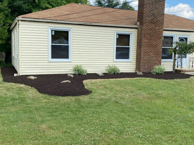 Cleaned up flower beds after Chestnut Landscaping removed a tree and several shrubs and installed new plants and mulch